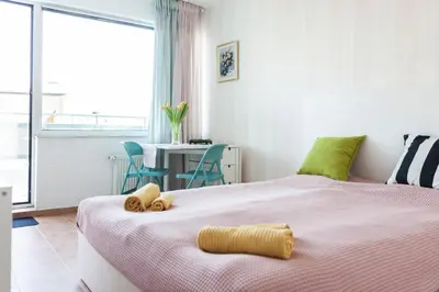 a bedroom with two beds with stuffed animals on it at Tony's Sunny Rooftop Studio by Flat Mаnager in Sofia