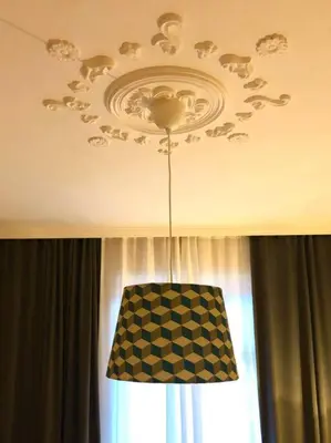 a chandelier hanging from a ceiling in a room at *CITADEL* 2BR - city center in Sofia