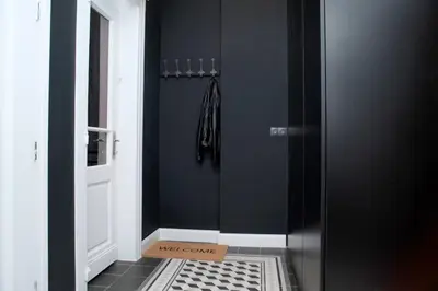 a door with a box on the floor in a hallway at *CITADEL* 2BR - city center in Sofia
