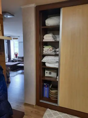 a room with a closet filled with folded towels at Apartment Svetoslava in Pamporovo