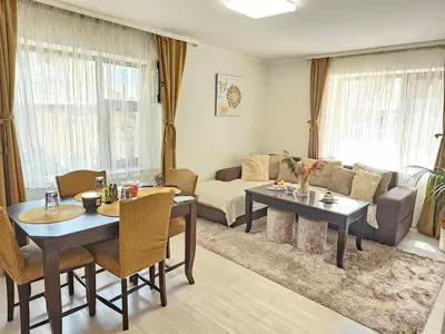 a living room with two tables and a couch at Апартамент за гости Криси гр. Девин in Devin