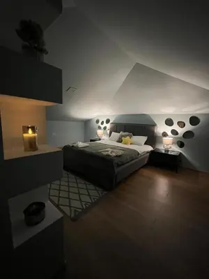 a bedroom with a large bed and two lamps at Cozy Apartment B35 in Grand Resort Pamporovo in Pamporovo