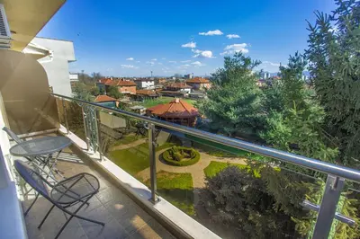 a balcony with a view of a garden at Парк-Хотел Клементина in Trud