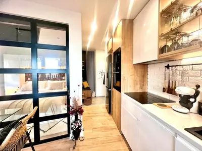 a kitchen with a large window in a room at Boutique lux design apartment @Bansko Royal Towers in Bansko