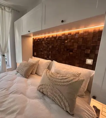 a bedroom with a large white bed with pillows at Boutique lux design apartment @Bansko Royal Towers in Bansko