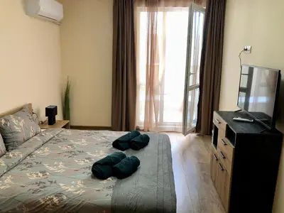 a bedroom with a bed with two pillows on it at Luxury apartment 1 Free Underground Secure Parking in Pazardzhik