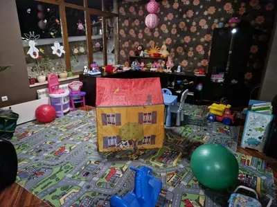 a room with a toy house on the floor at 1 bedroom luxury apartment Milena -free parking in Pamporovo