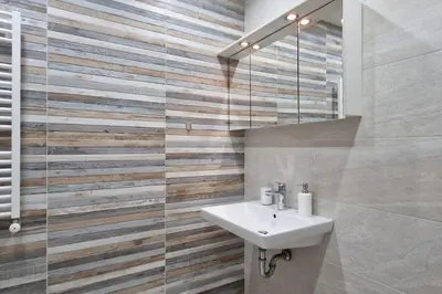 a bathroom with a sink and a mirror at Mila's 1 Bedroom Apartment in Sofia