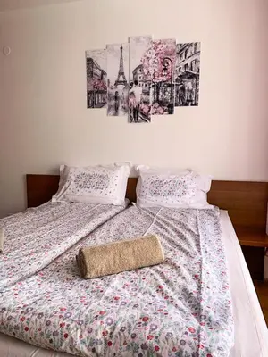 a bed with a comforter and a pillow on it at Semiramida gardens Apartment 23 in Borovets