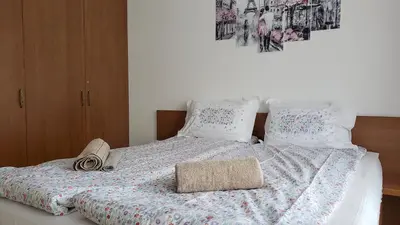 a bed with a blanket and a hat on it at Semiramida gardens Apartment 23 in Borovets