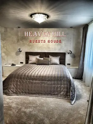 a bedroom with a bed and a sign that reads heaven hill guest house at Luxury guests house “Heaven Hill”, Pravets city in Pravets