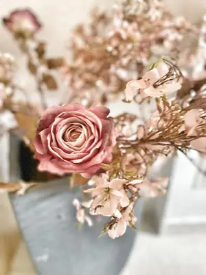 a bouquet of pink flowers in a vase at Luxury guests house “Heaven Hill”, Pravets city in Pravets
