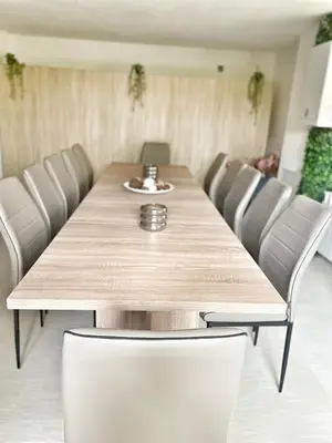 a dining room table with chairs around it at Luxury guests house “Heaven Hill”, Pravets city in Pravets