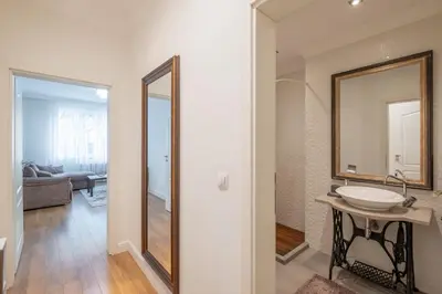 a bathroom with a sink and a mirror at St. Ivan Rilski flat in Sofia