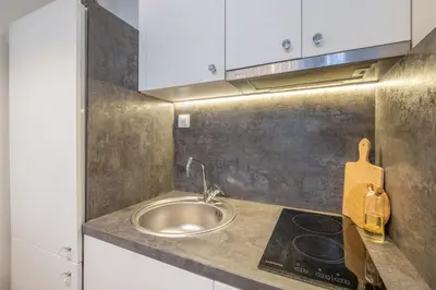 a kitchen with a sink and a counter top at St. Ivan Rilski flat in Sofia