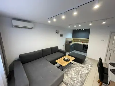 a living room with a couch and a table at Orpheus and Eurydice in Smolyan