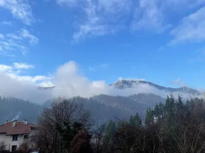 a view of a mountain with clouds in the sky at Orpheus and Eurydice in Smolyan