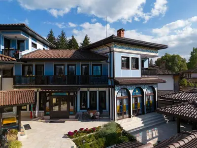 a large house with a lot of windows at Armaco Residence in Koprivshtitsa