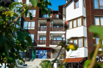 an apartment building with a sign on the side of it at !!!1min From The Lift I Luxury Studio In Pirin Palace in Bansko