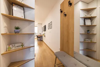 a hallway with shelves and a chair in a room at Luxury Studio Living High-End Amenities and Great Location by Flat Mаnager in Sofia