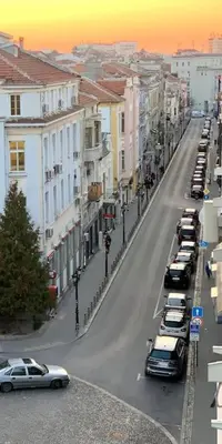 a city street with cars parked on the street at Студио Римски Стадион in Plovdiv