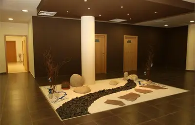 a lobby with a rug with animals on it at Aspen Golf Resort and SPA in Bansko