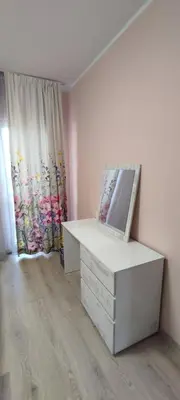 a room with a dresser and a window with a painting at Luxury and stylish apartmen, metro station Obelya in Sofia