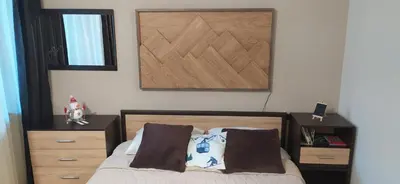 a bedroom with a bed with a wooden head board at Borovets Gardens Studio Raya in Borovets