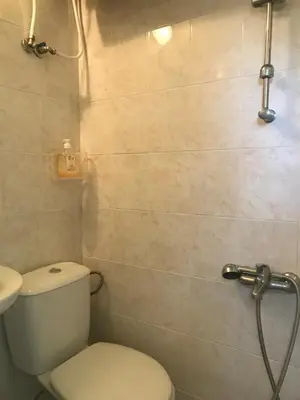 a bathroom with a toilet and a shower at The Backpacker's Spot - Bus & Railway Station Gem by Flat Mаnager in Sofia
