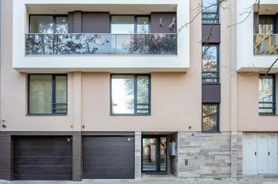 a facade of a house with two garage doors at Design Loft in the City Center in Sofia