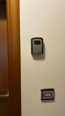 a door with a toaster hanging on a wall at Belvedere Holiday Club H62 Mountains View in Bansko