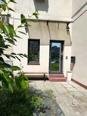 a door to a building with a window at Time Traveling Apartment Sofia Mladost District in Sofia