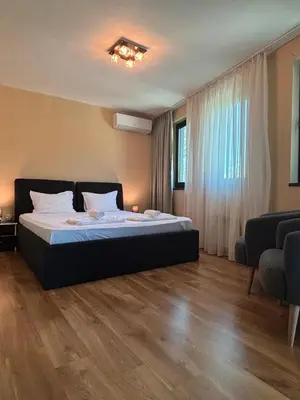 a bedroom with a large bed in a room at SPA Apartments Perun in Sandanski