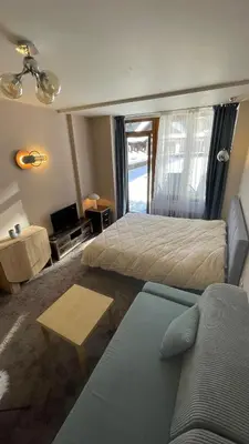 a hotel room with two beds and a couch at Borovets Hills Boro Boro Studio 35m2 in Borovets