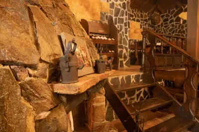 a room with a stone wall and a stone counter at Safari Village Velingrad in Velingrad