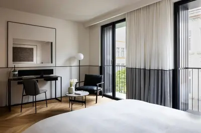a hotel room with a bed and a desk at Juno Hotel Sofia, a Member of Design Hotels in Sofia