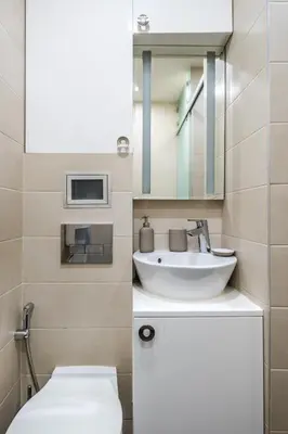 a bathroom with a sink and a toilet and a mirror at Luxury Studio Silver by Flat Mаnager in Sofia