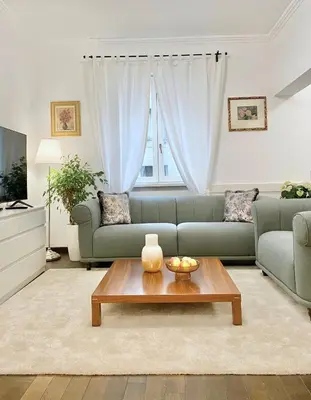 a living room with a couch and a coffee table at Vintage Top Centre Apartment in Sofia