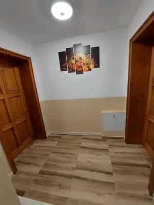 a room with two paintings on the wall at Къща за гости Бялото Конче in Beli Iskar