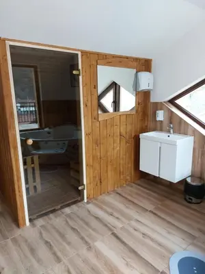 a bathroom with a sink and a mirror at Къща за гости Бялото Конче in Beli Iskar