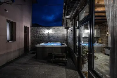 a bathroom with two sinks and a large tub at Никонел in Oborishte