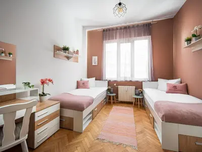 a room with two beds and a window at Free Parking And Parliament Is 1 Step Away in Sofia
