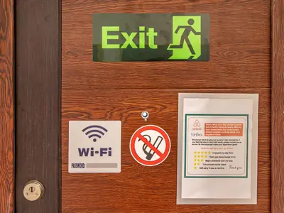 a door with exit signs and a sign on it at Vitosha Viewpoint - Chic City Studio in Sofia