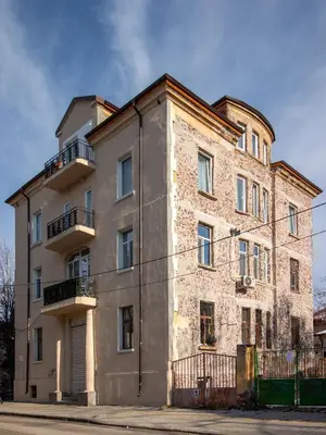 an old brick building on the corner of a street at Vitosha Viewpoint - Chic City Studio in Sofia