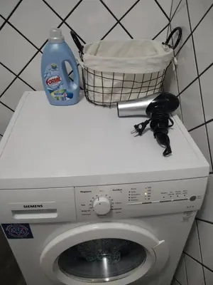 a washing machine with a basket on top of it at Studio Panagyurishte in Panagyurishte