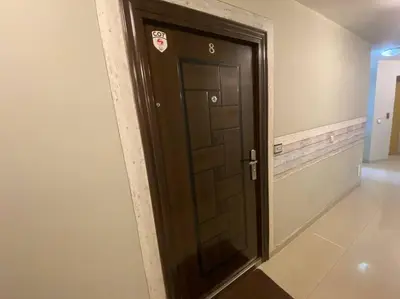a black door with a sign on it in a hallway at Lovely 1-bedroom apartament with free parking in Sofia