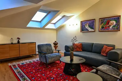 a living room with a couch and a table at Едно Време in Karlovo