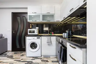 a kitchen with a washing machine and a washer at Florance flat next to Old Town & City Center NEW in Plovdiv