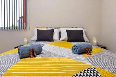 a bedroom with two beds with pillows on it at Florance flat next to Old Town & City Center NEW in Plovdiv