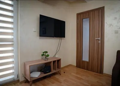 a living room with a flat screen tv on a wall at Apart Centar in Plovdiv